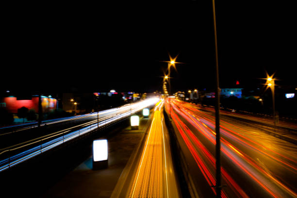 istock Car lights in traffic at night. Long exposure shot. defocused. 1451098140