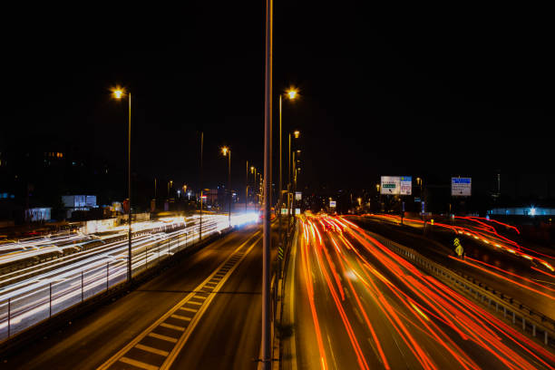istock Car lights in traffic at night. Long exposure shot. defocused. 1451098148