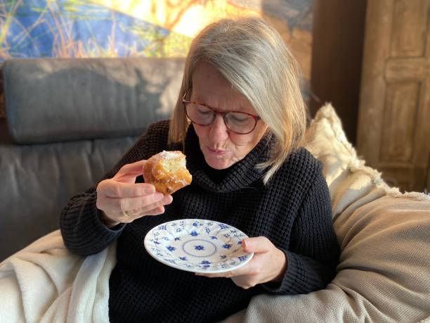 istock Eating an Oliebol 1451098184