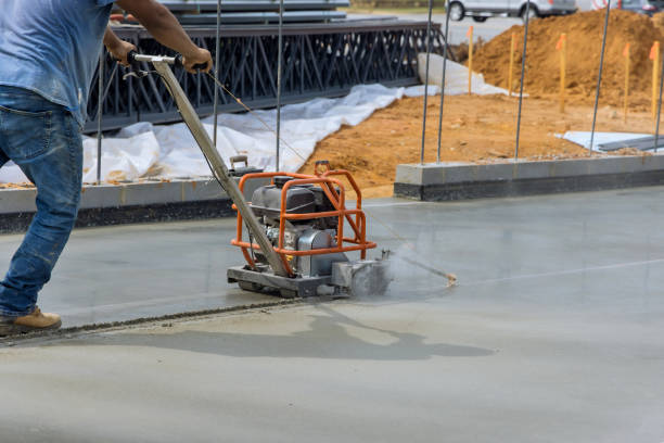istock Worker using cutting machine are cutting concrete for expansion isolation joint of foundation concrete after pouring 1451098999