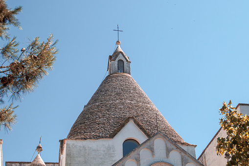 Church with an architecture similar to the trulli, with its conical dome of stacked stones.