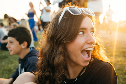 Teenagers goofing around at summer music festival