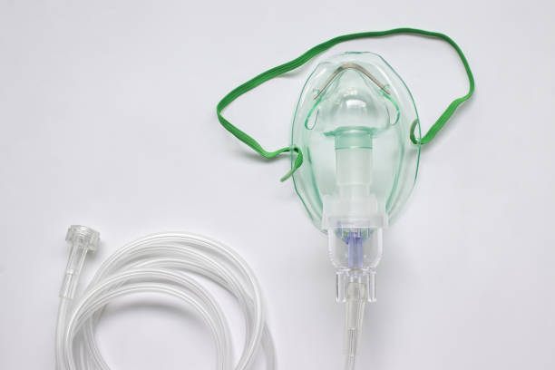 istock Oxygen mask with inhaler bulb on a white background. 1451100561