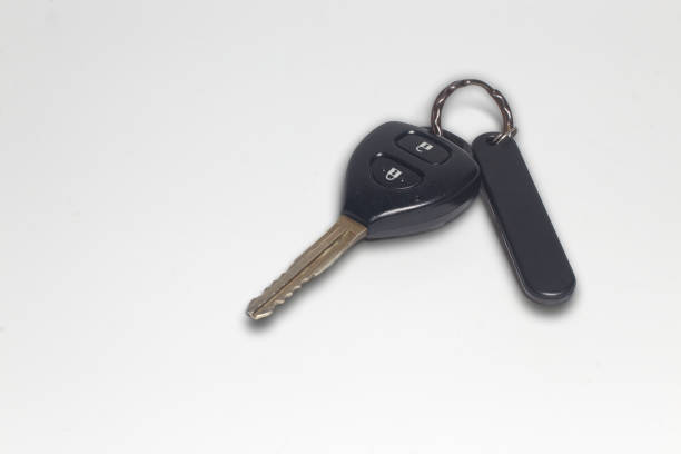 istock remote car key with trinket isolated on white, top view 1451100569