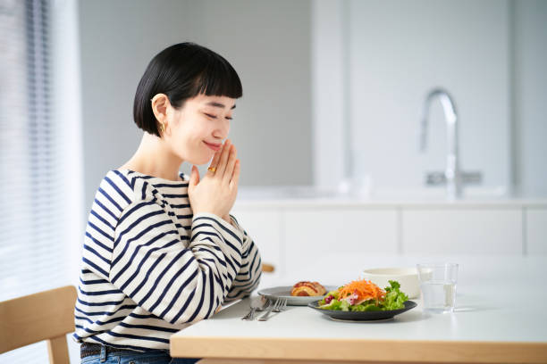 istock Young woman starting a meal 1451102578