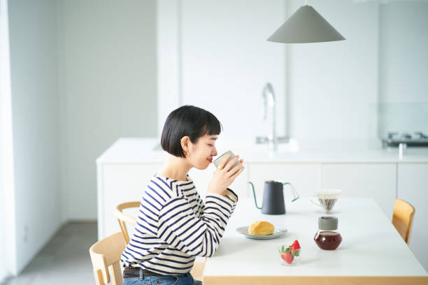 istock woman drinking coffee in the room 1451104397
