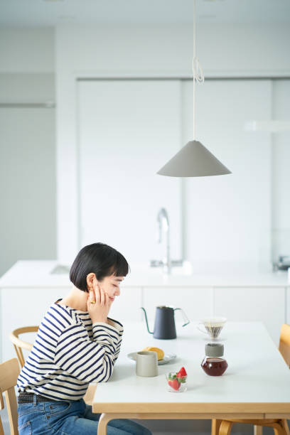 istock woman drinking coffee in the room 1451104611