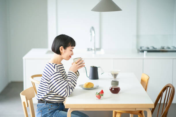 istock woman drinking coffee in the room 1451104825
