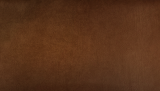 brown genuine leather texture background for vintage, classic concept. light brown background for decorations and textures. dark orange, brown color leather skin natural with design lines pattern.