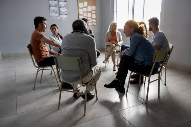 Group of people talking in a therapy session