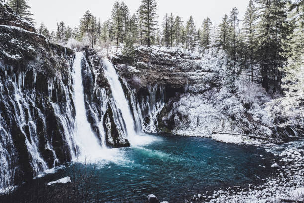 Winter Waterfall Winter Waterfall at Burney Falls, California burney falls stock pictures, royalty-free photos & images