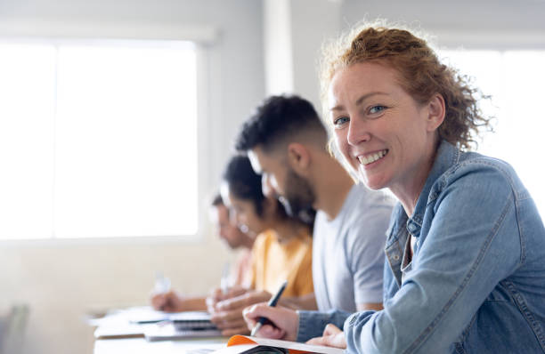Happy college student smiling in class