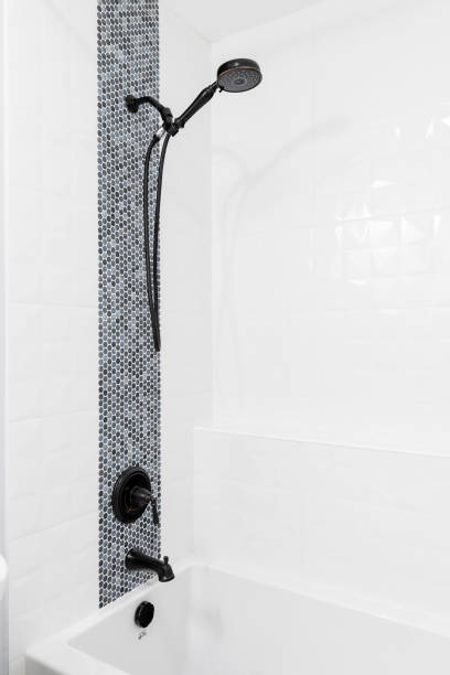 istock A shower and bathtub with grey and white tiles. 1451109982