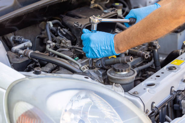 istock Repair of vehicle engine. Car spark plug and ignition coil change or replacement. 1451110184