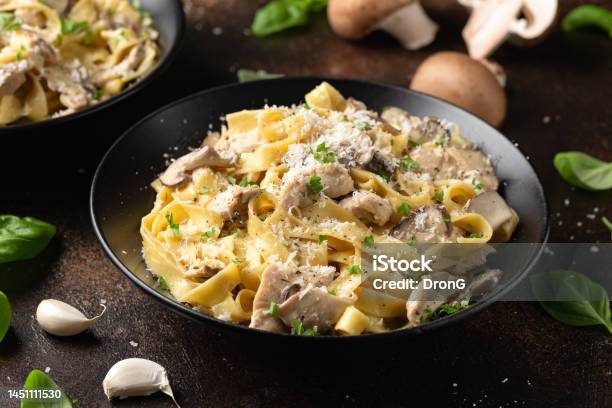 Creamy Alfredo Pasta With Chicken Mushrooms And Parmesan Cheese Healthy Italian Food Stock Photo - Download Image Now
