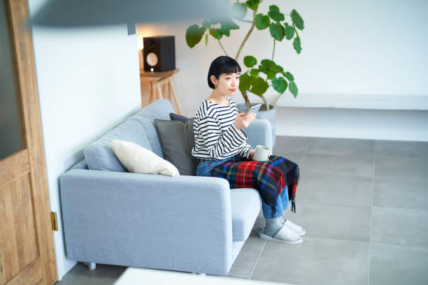 istock Young woman operating a smartphone 1451118442
