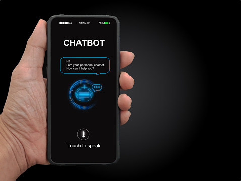 A man's hand holding mobile smartphone with chatterbot application for online information. Digital chatbot, conversational agents, robot app, conversation assistant. AI Artificial intelligence concept