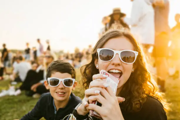 Photo of Teenagers goofing around at music festival