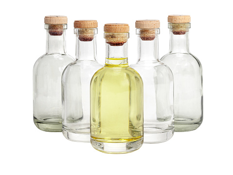 front view of white wine bottle with black cap enclosure on white background