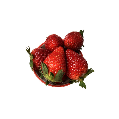 Strawberries on a round plate isolated berries, sweet delicious summer fruit full of vitamins, clipping path, side view