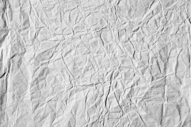 istock Natural grey crumpled paper texture 1451128406