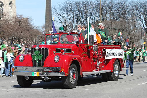 Indianapolis, Indiana-March 17,2010: Retired Indianapolis Firefighters Club Members with Old Red Truck Greets People at St. Patrick's Day Parade