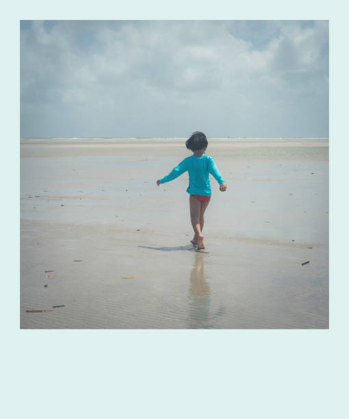 istock Child boy walking on the beach 1451129214
