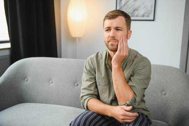 istock Man suffering from tooth ache in morning 1451130377