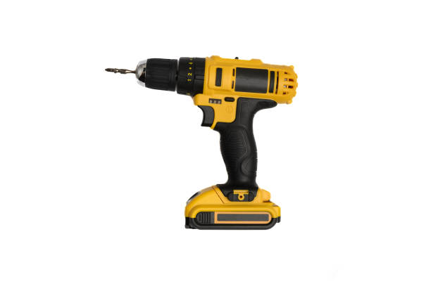 istock Cordless electric yellow screwdriver isolated on white background. Close-up. 1451130865
