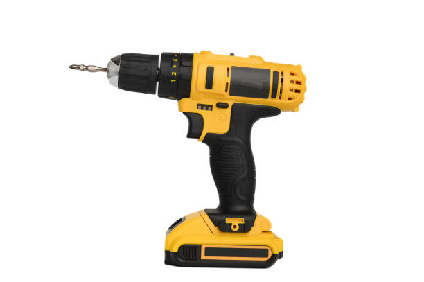 istock Cordless electric yellow screwdriver isolated on white background. Close-up. 1451130871