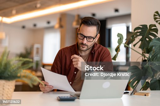 istock Businessman constantly working stock photo 1451131632
