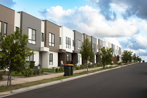 Modern residential townhouses homes in Queensland Australia. Real estate housing development and property market. Homeownership Conceptual photo