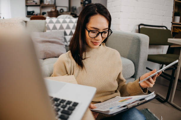 istock Woman working on digital tablet at home 1451136613