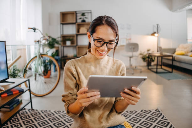 istock Relaxing in the living room with tablet 1451137900