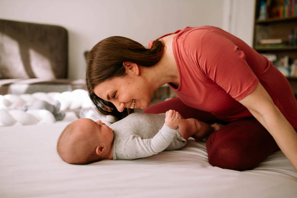 istock Smiling baby and his mom 1451138263