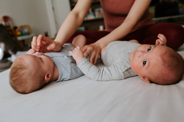 istock Happy mother with her twins 1451138348