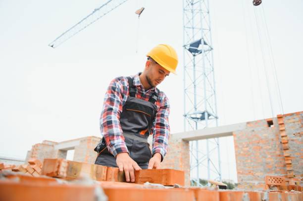 istock Construction worker in uniform and safety equipment have job on building 1451138362