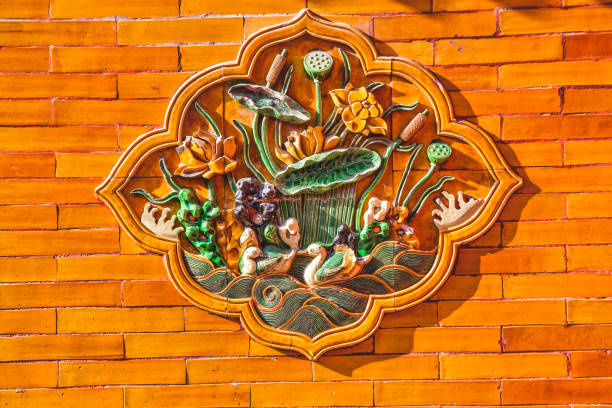 Brick wall carved with a lion pattern, lion pattern relief.