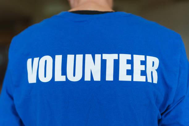 istock Man wearing volunteer shirt 1451139840
