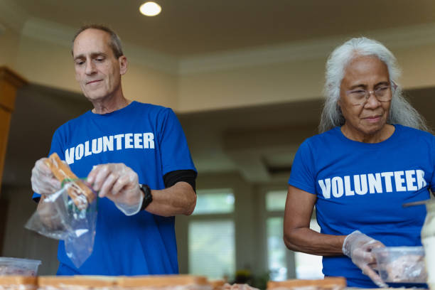 istock Retired couple volunteering together 1451139867
