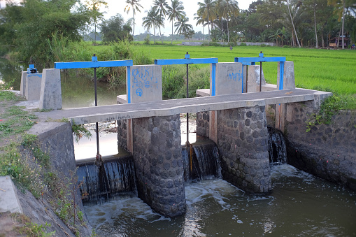 Klaten, Indonesia, June 14, 2020. Irrigation system on river banks to regulate the irrigation of residents' agriculture
