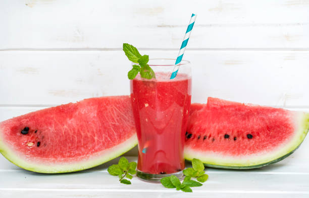istock Watermelon Smoothie In A Jar With Mint And Lemon 1451140826
