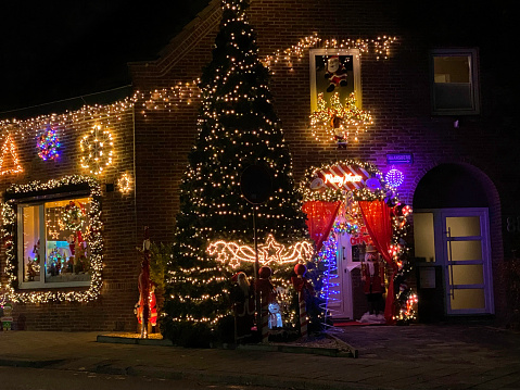 Brunssum, Netherlands- December 12, 2022. Christmas decorated house on a December evening.