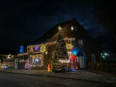 Brunssum, Netherlands- December 12, 2022. Christmas decorated house on a December evening.