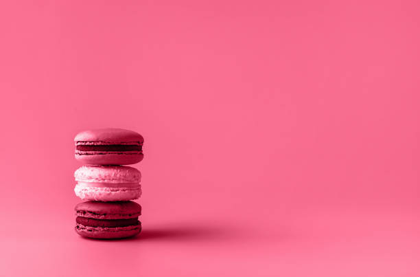 istock Three macaroons in stack toned in trendy magenta color of year 2023. 1451148328