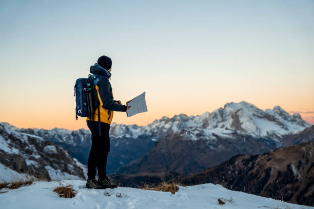 istock Man hiking searching trails on map-Orientation 1451148891