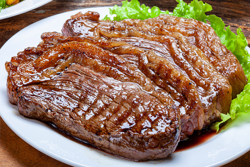 Steak rotisserie at the steakhouse, sliced picanha