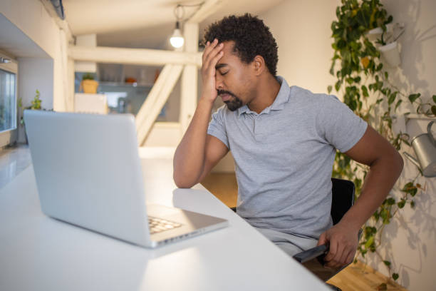 istock Young man suffering from pain 1451149927