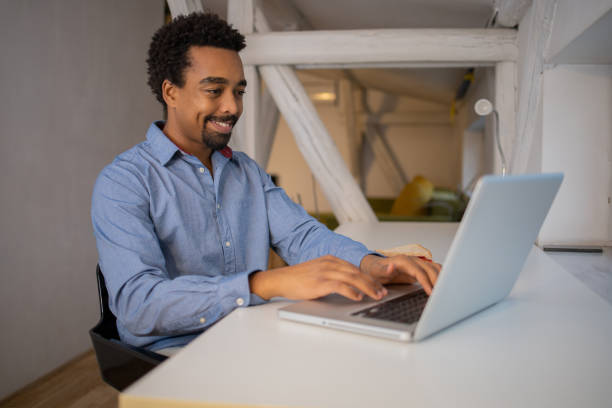 istock Young fashionable man working at home 1451150360