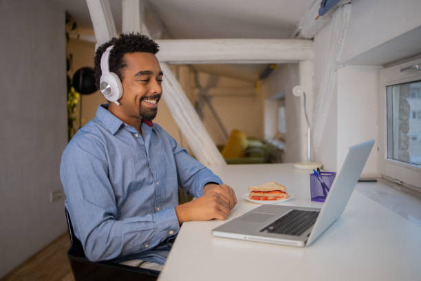 istock Young fashionable man working at home 1451150377